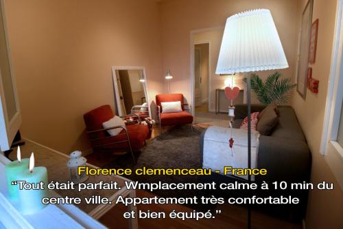 a living room with a couch and chairs and a lamp at LivingPorto Boavista in Porto