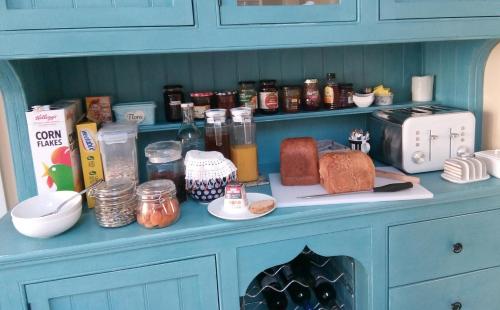 a blue counter with bread and other items on it at Rosslyn Court in Margate