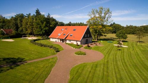 an aerial view of a house with an orange roof at 't Borghuis in Losser