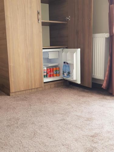 an open refrigerator with food and drinks in it at Villa Lotus in Deva