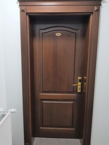a wooden door in a room at Villa Lotus in Deva