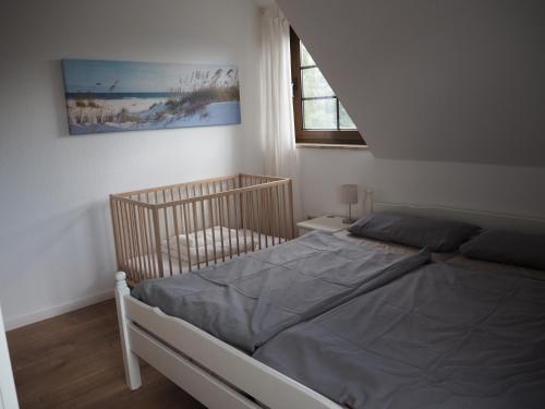Postel nebo postele na pokoji v ubytování Ferienhaus Mundan 2