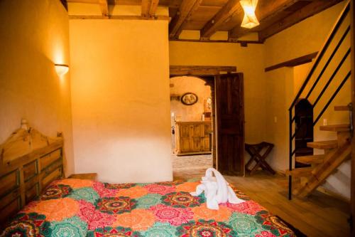 Postel nebo postele na pokoji v ubytování Hotel Casa de Gandhi
