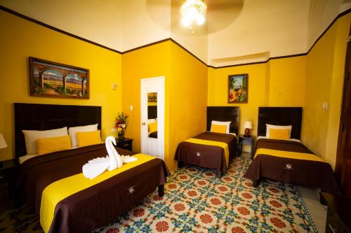 Postel nebo postele na pokoji v ubytování Hotel del Peregrino Boutique Hotel