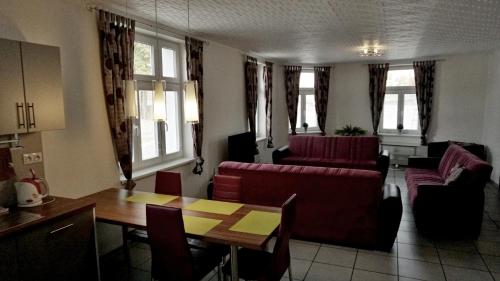 a living room with a couch and a table at Alegria Natur Apartments in Mikulov