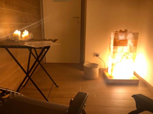 a room with a table with candles on the floor at Relais Dei Mandorli in Bergamo