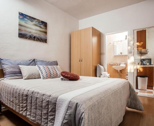 Postel nebo postele na pokoji v ubytování Apartments Nora