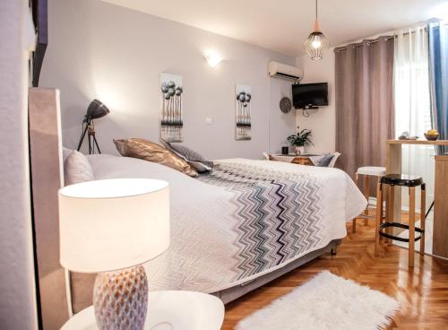 Postel nebo postele na pokoji v ubytování Apartments Nora