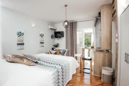 Katil atau katil-katil dalam bilik di Apartments Nora