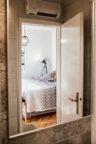 Postel nebo postele na pokoji v ubytování Apartments Nora