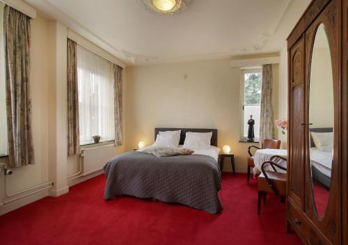 Katil atau katil-katil dalam bilik di Hotel de Abdij