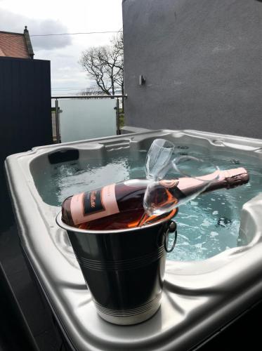 a hot dog in a bucket in a hot tub at Daisy House Filey in Filey