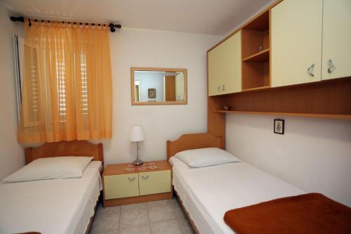 Llit o llits en una habitació de Apartments Ali - modern apartments