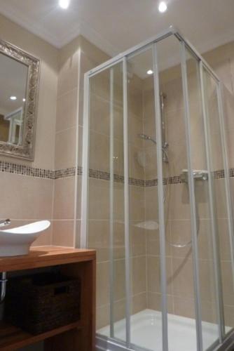 a shower with a glass door in a bathroom at "Stine" in Westerland