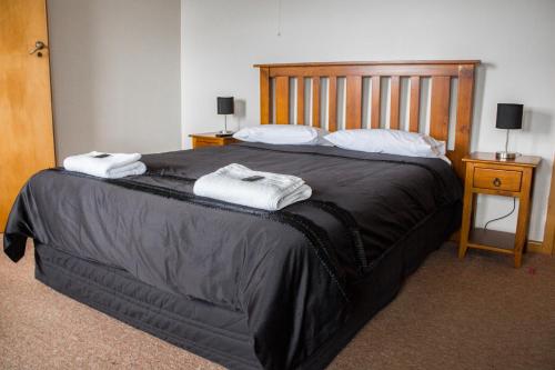 Säng eller sängar i ett rum på The Pier Lodge Bed And Breakfast