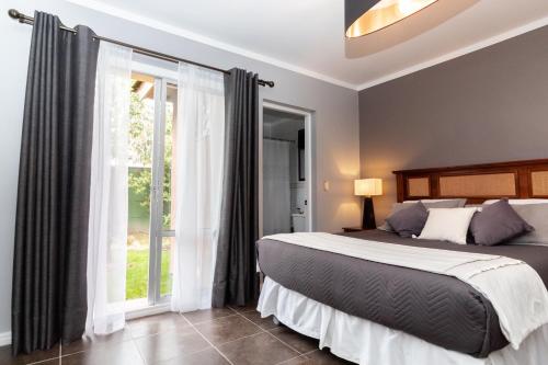 Ένα ή περισσότερα κρεβάτια σε δωμάτιο στο Santa Teresita Boutique Hotel