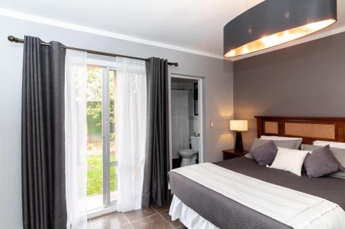 A bed or beds in a room at Santa Teresita Boutique Hotel
