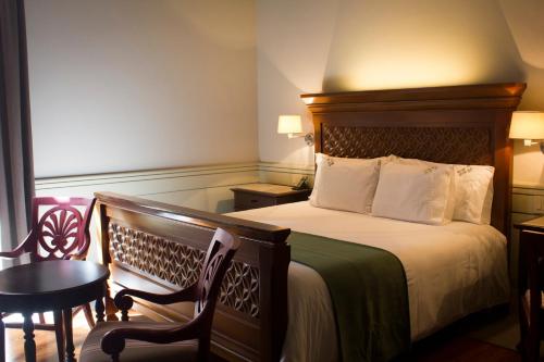 Säng eller sängar i ett rum på Casa Grande Hotel Boutique