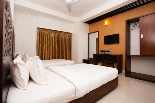 Кровать или кровати в номере La Vista Hotel