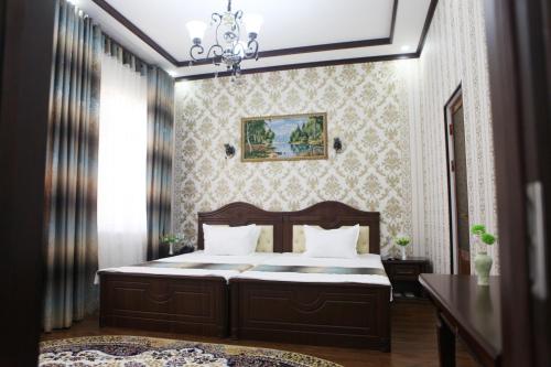 Ένα ή περισσότερα κρεβάτια σε δωμάτιο στο Hotel Naxshab