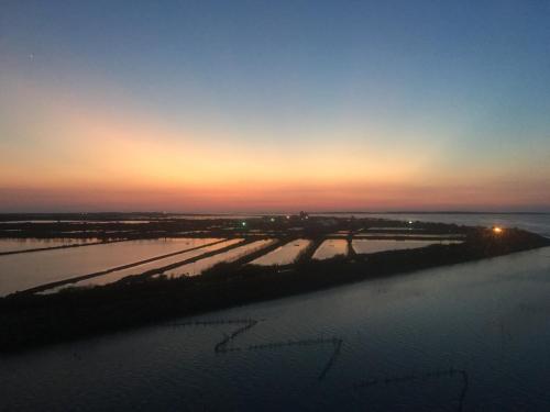 an aerial view of a river at sunset at Lan People Villa in Qigu