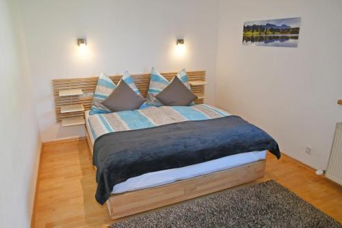 a bedroom with a large bed in a room at Apartments Weißstein in Gries im Sellrain