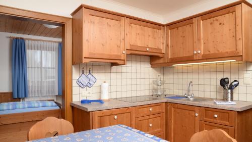 Kuchyň nebo kuchyňský kout v ubytování Appartments Pizach