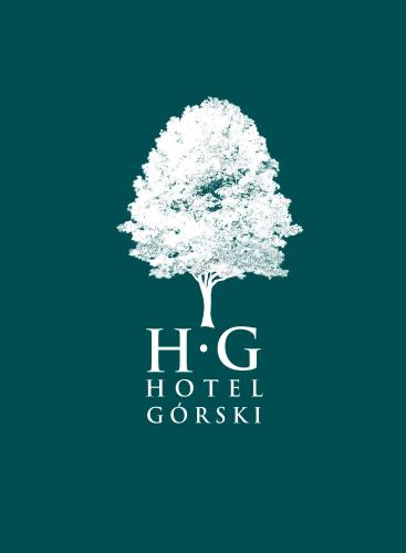 a tree logo on a blue background at Hotel Górski Czarna Góra in Stronie Śląskie