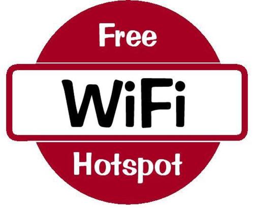 a red sign that says free wifi hotspot at Hotel Ladias in Monodendri