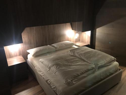 Ein Bett oder Betten in einem Zimmer der Unterkunft Genziana 2