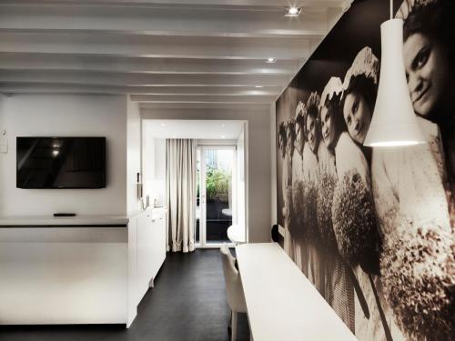 a living room with a large black and white wall at Hotel Harmony in Ghent