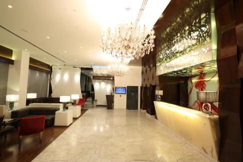 a lobby of a hotel with a chandelier at The Elanza Hotel, Bangalore in Bengaluru