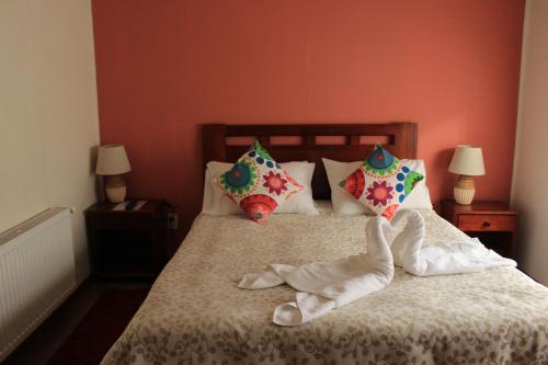 Cama o camas de una habitación en Hotel Milodon