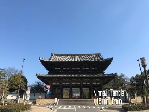 a large building with a sign in front of it at 一棟貸切り宿 GuestHouse 嵯峨嵐山 in Kyoto
