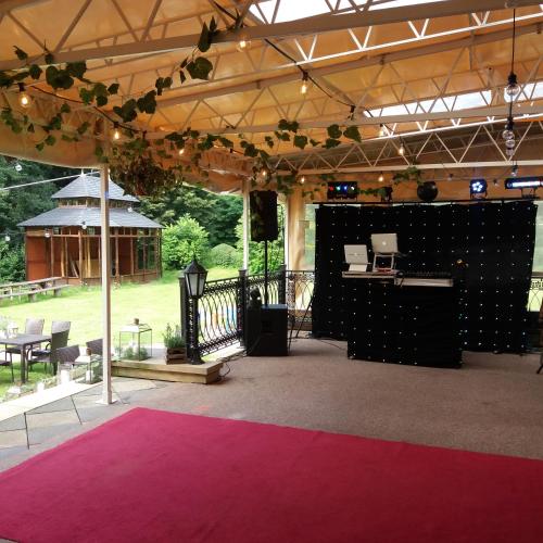 a tent with a pink carpet and a stage at Pałac Bażantarnia in Pszczyna