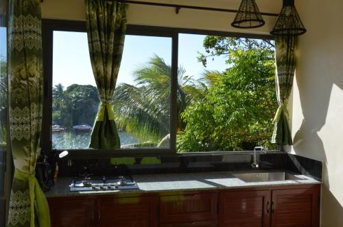 Fotografie z fotogalerie ubytování Riverside Holiday Home v destinaci Grande Rivière Sud Est