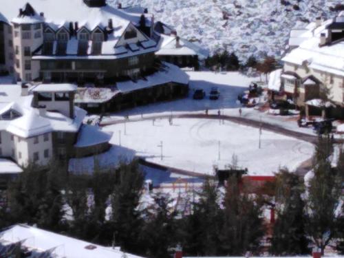 a snow covered city with a rink in the snow at ERASE OTRA VEZ en sierra nevada in Sierra Nevada
