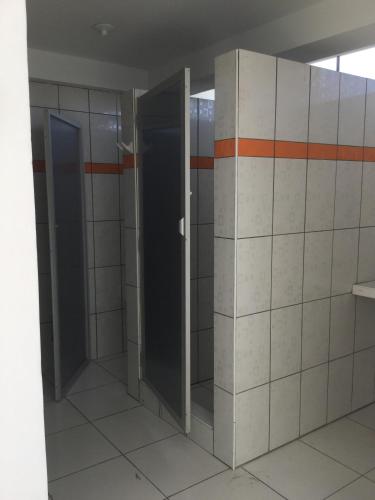 an empty bathroom with two elevators in a building at Antares Paracas in Paracas