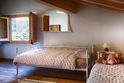מיטה או מיטות בחדר ב-Can Pedragos