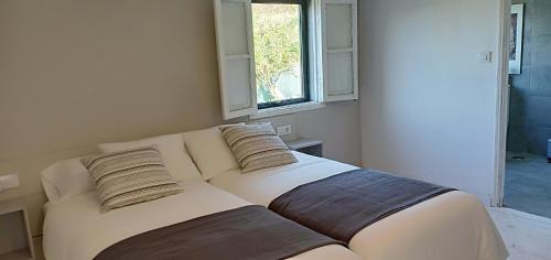 En eller flere senge i et værelse på Casa da Viña - Ribeira Sacra