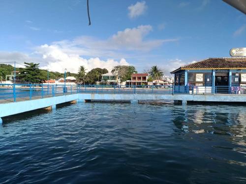a bridge over a body of water with a building at Hotel Castelo La Paloma in Gamboa
