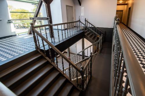an overhead view of a staircase in a building at Liepaja Apartments in Liepāja