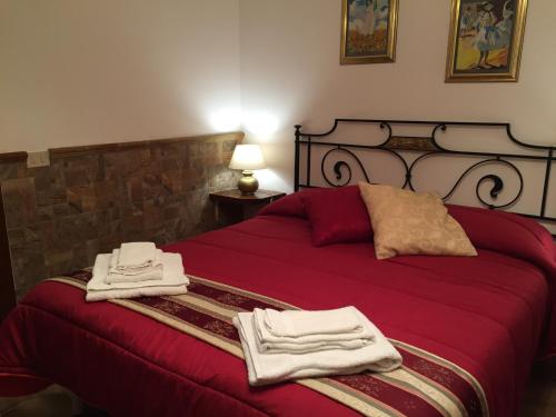 En eller flere senge i et værelse på Etna View Affittacamere