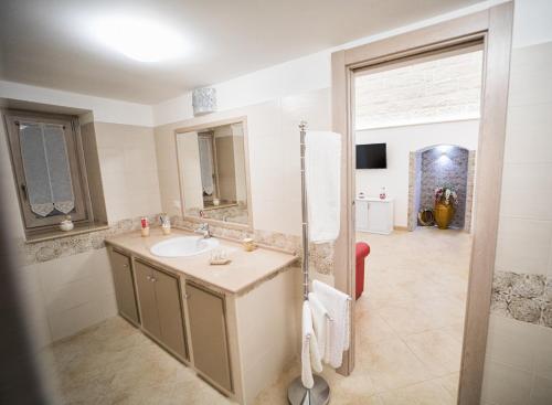 a bathroom with a sink and a shower at Il Galante B&B casa vacanza in Ginosa