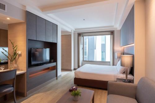 Katil atau katil-katil dalam bilik di Jasmine City Hotel