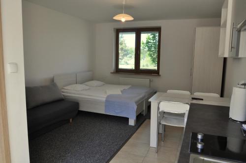 Postel nebo postele na pokoji v ubytování Gościniec Kaszubski Homestay