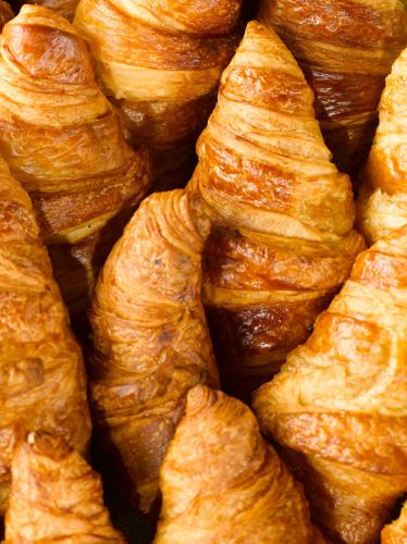 a pile of croissants sitting next to each other at Campanile Saint-Germain-En-Laye in Saint-Germain-en-Laye