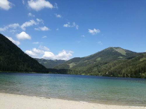 a view of a lake with mountains in the background at Apartment Mariazell Bürgeralpe in Mariazell