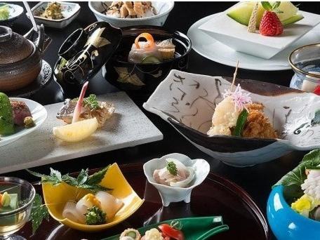 a table with several plates of food on plates at Hotel Shiki Utsubo Park in Osaka