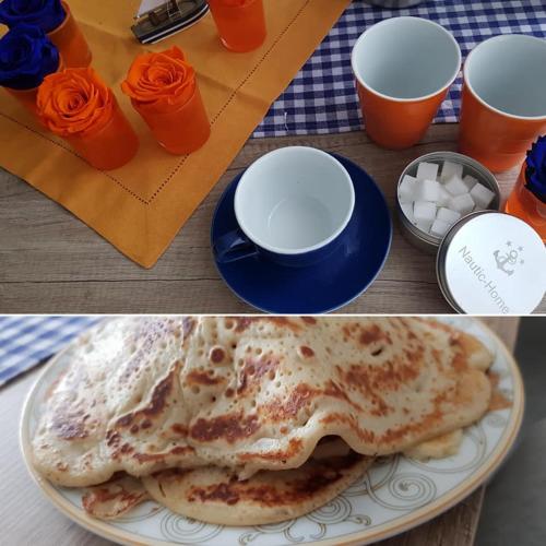 two pictures of a plate with two pancakes and two cups at Hotel Garni in Herborn